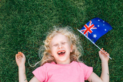 Caucasian girl holding australian flag. kid citizen celebrating australia day holiday 