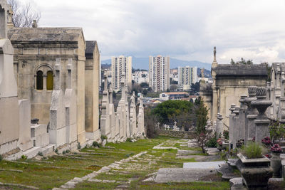 Buildings in city against sky