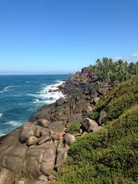 Scenic view of sea against clear blue sky