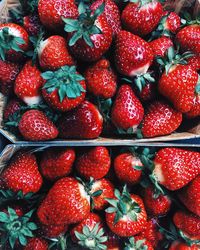 Full frame shot of strawberries in boxes for sale at market stall