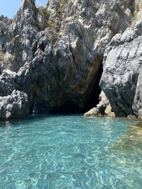 Scenic view of rock formation in sea