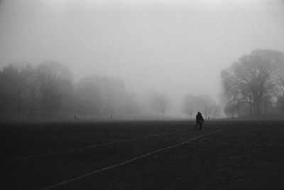 Couple walking during foggy weather