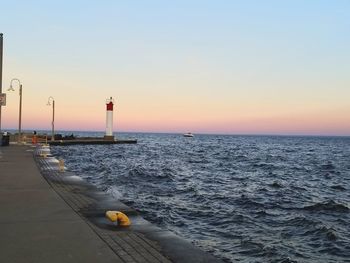 Scenic view of sea against clear sky during sunset