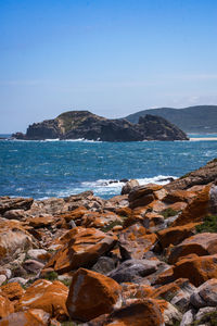 Scenic view of sea against clear blue sky