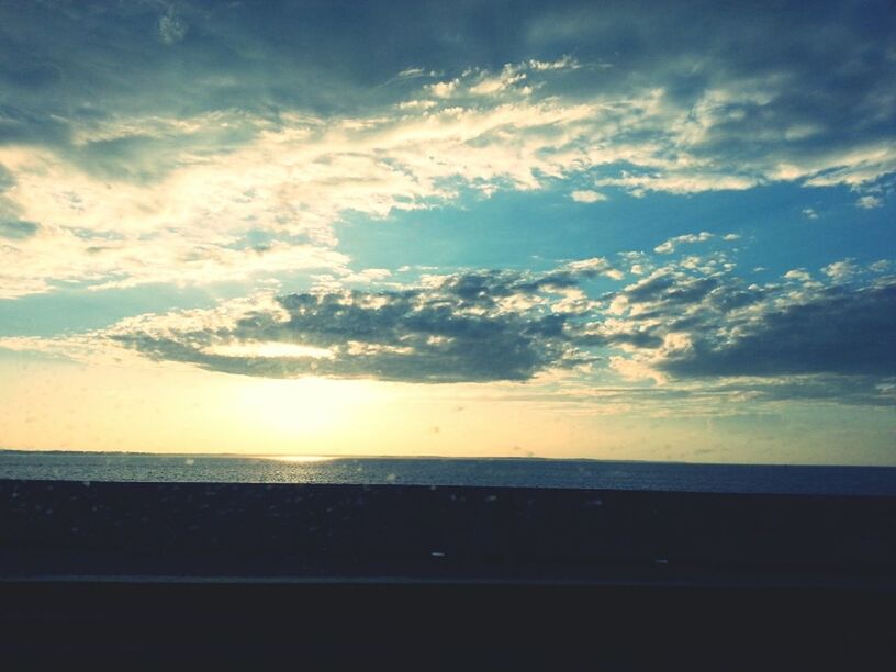 sea, sky, horizon over water, scenics, tranquil scene, beauty in nature, water, tranquility, cloud - sky, sunset, nature, idyllic, cloud, beach, silhouette, cloudy, sun, shore, sunlight, outdoors