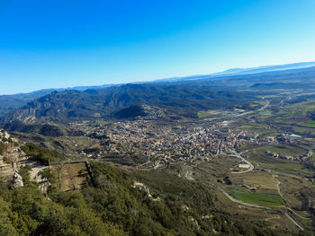 High angle view of landscape against clear blue sky