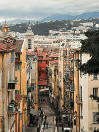 High angle view of buildings in city against sky