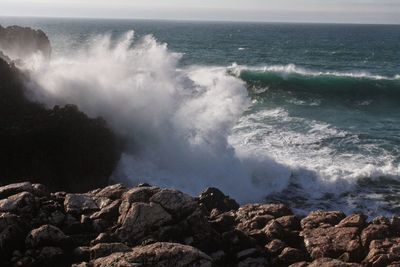 Waves splashing on rocks