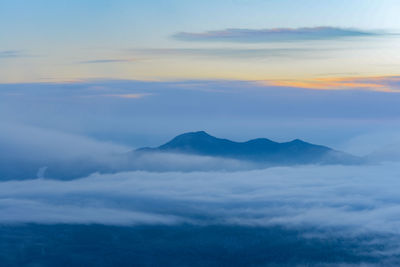 Scenic view of mountains against sky during sunset