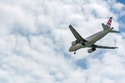 Commercial passenger jet airplane in mid flight, getting ready for landing