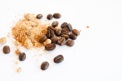 Close-up of coffee beans against white background