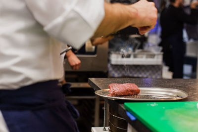 Man preparing food in restaurant