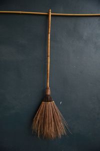 Close-up of umbrella against wall