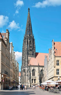 Group of people in front of buildings in city