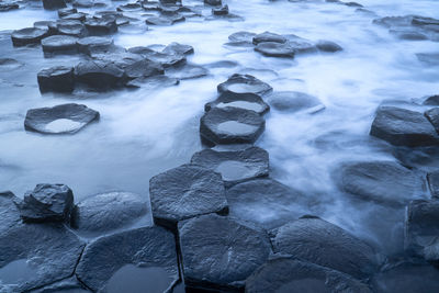 Giant's causeway texture rocks in the sea