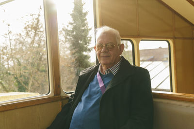 Germany, dresden, senior man sitting in cable railway