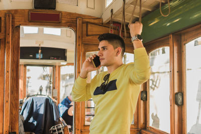 Full length of young man photographing