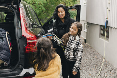 Girl and woman in car