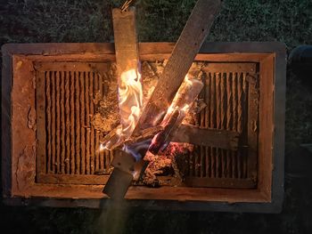 High angle view of fire on log