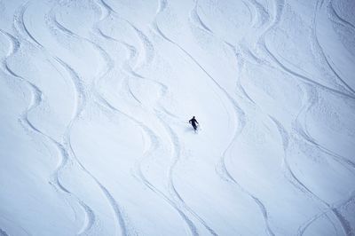 Person skiing on snow covered mountain