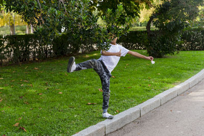 Young boy alone. having fun in a park.