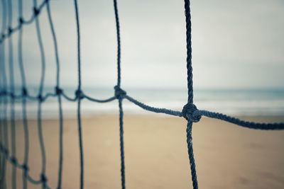 Beach and sea seen through netting