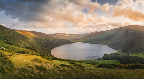 Dramatic sunset at lough tay, called the guinness lake located in wicklow mountains