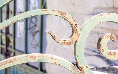 Close-up of rusty railing on sunny day