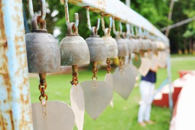 Close-up of bell hanging on field