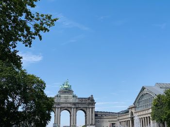 Low angle view of historical building against blue sky