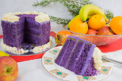 Close-up of cake and fruits on table during christmas