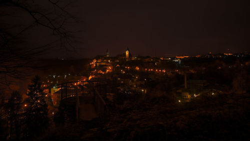 High angle view of illuminated buildings in city at night