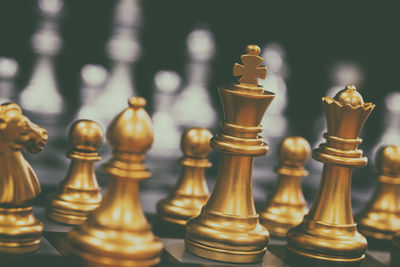 Close-up of chess pieces on table