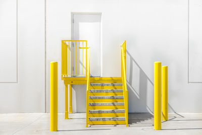 Yellow staircase against building