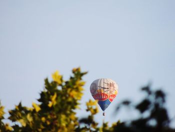 Low angle view of hot air balloon against clear sky