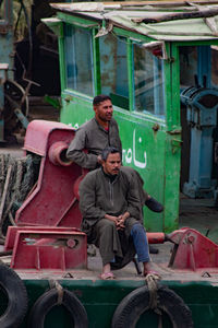 Full length of a boy sitting on vehicle