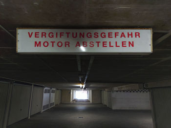 Information sign in illuminated underground walkway