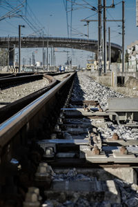 Railroad tracks against bridge