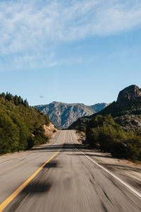 Empty road against sky