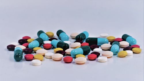 Close-up of multi colored pencils over white background