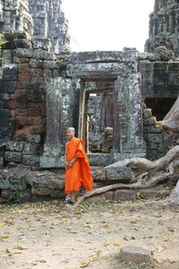 Rear view of man on temple against building