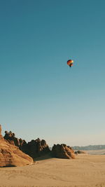 Low angle view of hot air balloon against clear sky