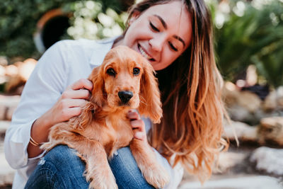 Portrait of young woman with dog