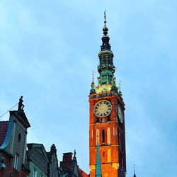 Low angle view of clock tower against sky