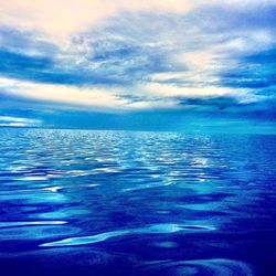 Scenic view of calm sea against blue sky