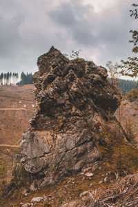 Rock formation on land against sky