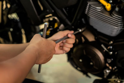 Close-up of man working at machine