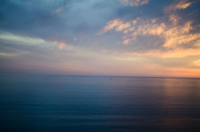 Scenic view of sea against sky at sunset