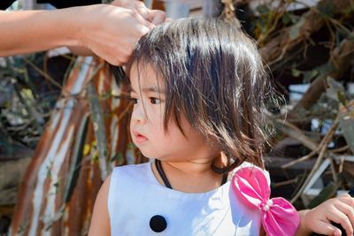 Close-up of innocent baby girl looking away