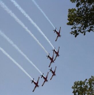 LOW ANGLE VIEW OF AIRPLANE FLYING IN SKY